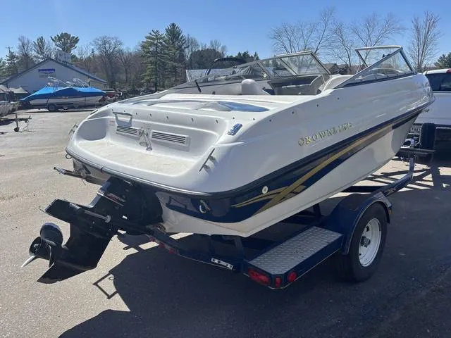 Slide: The Image of 2000 Crowline 180 BR boat on trailer, parked outdoors. - 6