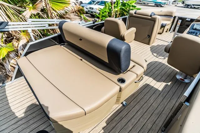 Slide: The Image of 2025 Starcraft EX20QDH boat interior with tan seating and wood-style flooring. - 14