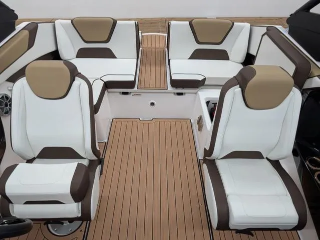 Slide: The Image of 2023 Yamaha Boats 222SD interior with white and brown seating, teak-style flooring. - 11