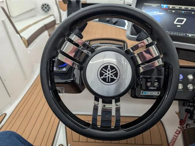 Slide: The Image of Steering wheel of 2023 Yamaha Boats 222SD, featuring sleek design and modern controls. - 5