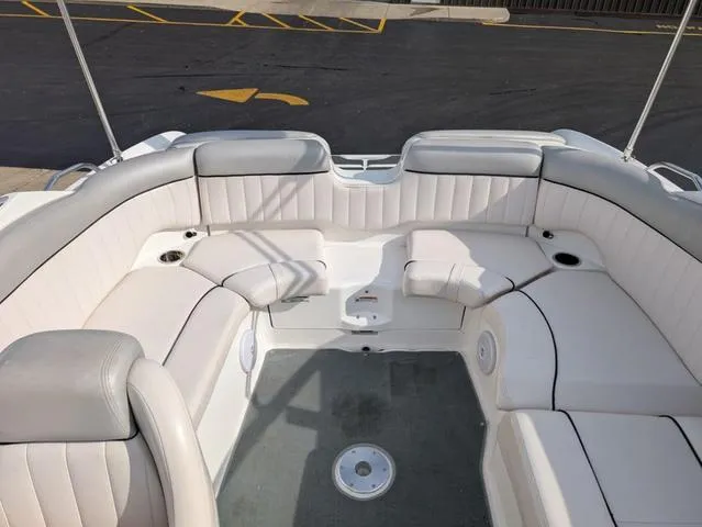 Slide: The Image of 2009 Yamaha Boats SX 230 interior with white cushioned seating and spacious layout. - 15