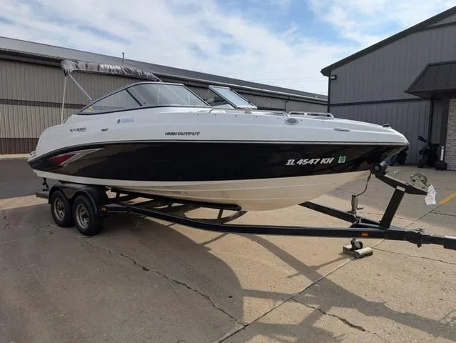 Slide: The Image of 2009 Yamaha Boats SX 230 on trailer, parked outdoors near a building. - 3