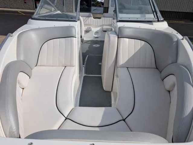 Slide: The Image of 2009 Yamaha Boats SX 230 interior with white and gray seating, showcasing spacious design. - 8