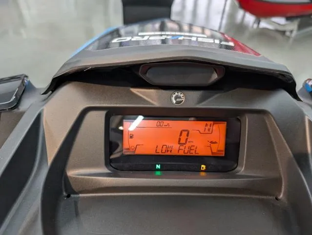 Slide: The Image of 2024 Sea-Doo Fishpro™ Scout 130 dashboard displaying low fuel warning. - 5