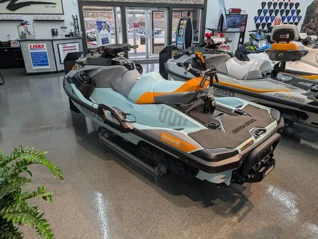 Slide: The Image of 2024 Sea-Doo Waverunner Wake on showroom floor, sleek design, vibrant colors. - 3