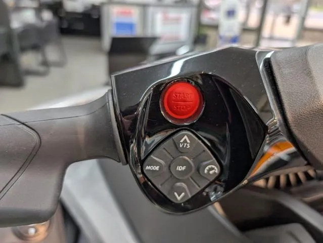 Slide: The Image of 2024 Sea-Doo Waverunner Wake handlebar controls with start/stop button and navigation features. - 4