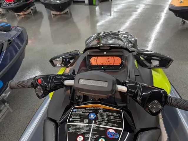 Slide: The Image of 2024 Sea-Doo RXP-X 325 Ibr dashboard, Ice Metal/Green, showroom display. - 4
