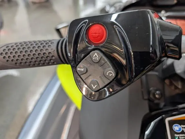 Slide: The Image of 2024 Sea-Doo RXP-X 325 Ibr handlebar controls with red stop button and mode settings. - 6