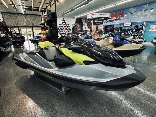 Slide: The Image of 2025 Sea-Doo Waverunner RXP-X™ 325 on display in showroom, featuring sleek design and vibrant colors. - 2