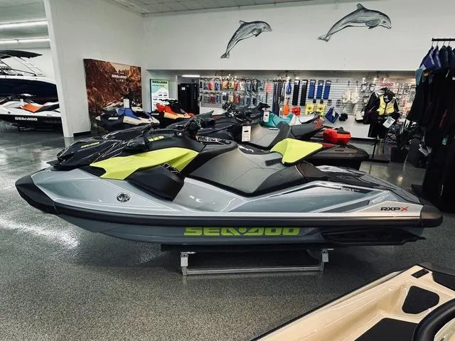 Slide: The Image of 2025 Sea-Doo RXP-X™ 325 Tech Waverunner in showroom, sleek design, ice metal color. - 4