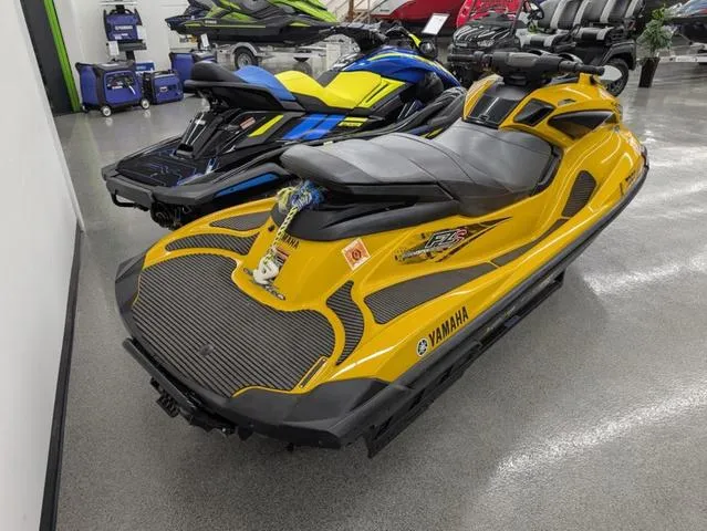 Slide: The Image of 2014 Yamaha WaveRunner FZS® in showroom, yellow and black design. - 2