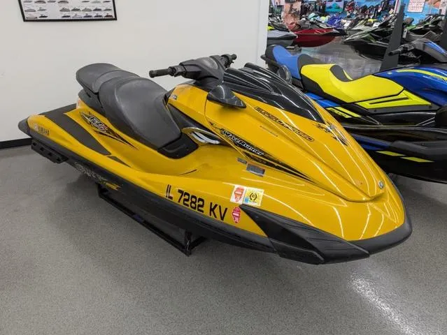 Slide: The Image of 2014 Yamaha WaveRunner FZS® in yellow, displayed indoors on a showroom floor. - 3