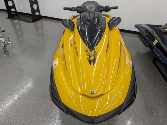 Slide: The Image of 2014 Yamaha WaveRunner FZS® in yellow, displayed indoors on a polished floor. - 4