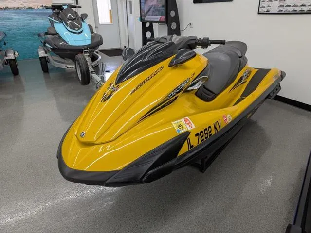 Slide: The Image of 2014 Yamaha WaveRunner FZS® in showroom, yellow and black design, sleek and sporty appearance. - 5