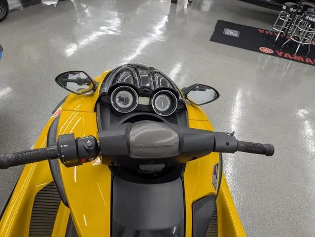 Slide: The Image of 2014 Yamaha WaveRunner FZS® in showroom, yellow with dual mirrors and handlebar controls. - 7