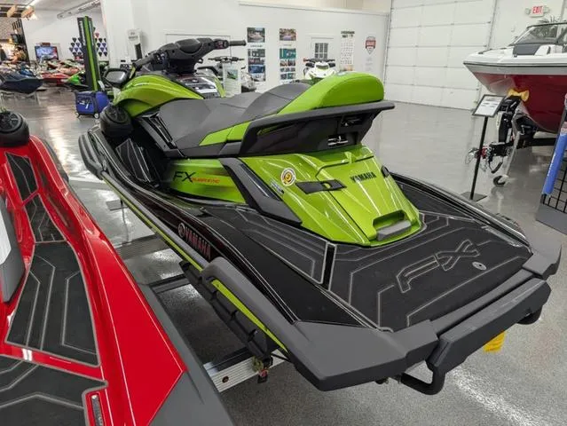 Slide: The Image of 2024 Yamaha WaveRunner FX Cruiser SVHO in vibrant green on display in showroom. - 4