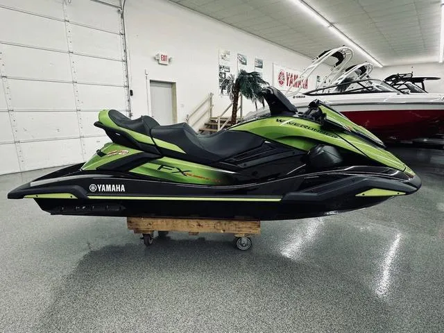 Slide: The Image of 2024 Yamaha WaveRunner FX Cruiser SVHO in vibrant green and black design. - 1