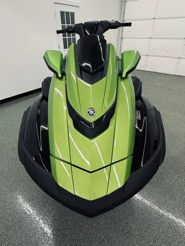 Slide: The Image of 2024 Yamaha WaveRunner FX Cruiser SVHO in vibrant green, front view in showroom. - 3