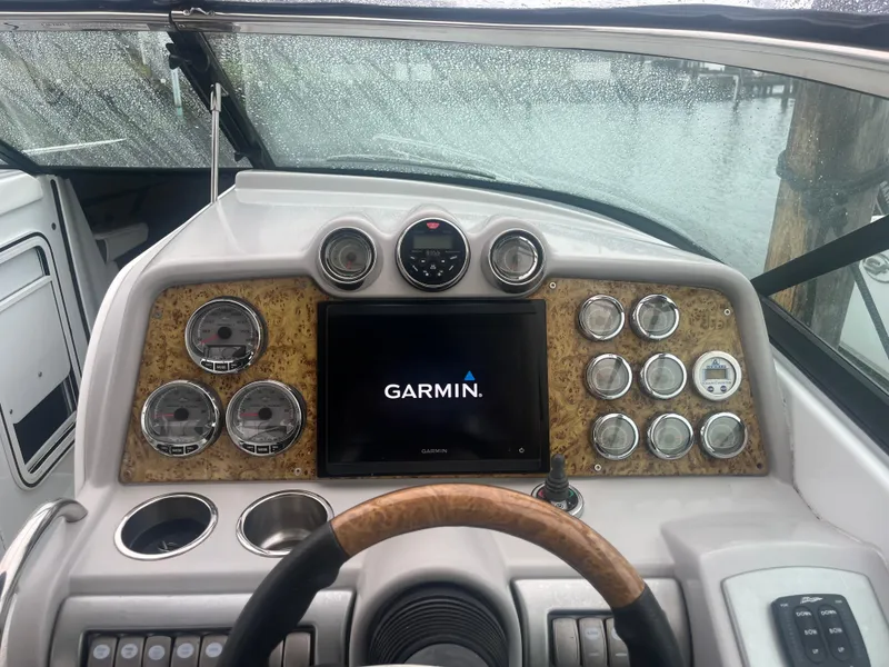 Slide: The Image of 2008 Formula 310 Bowrider dashboard with Garmin display and multiple gauges. - 12