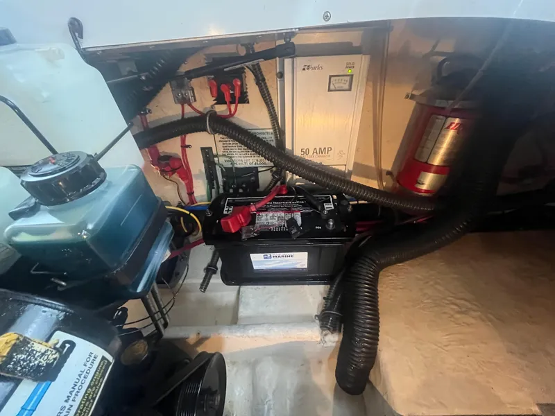 Slide: The Image of 2008 Formula 310 Bowrider engine compartment with battery and wiring. - 17