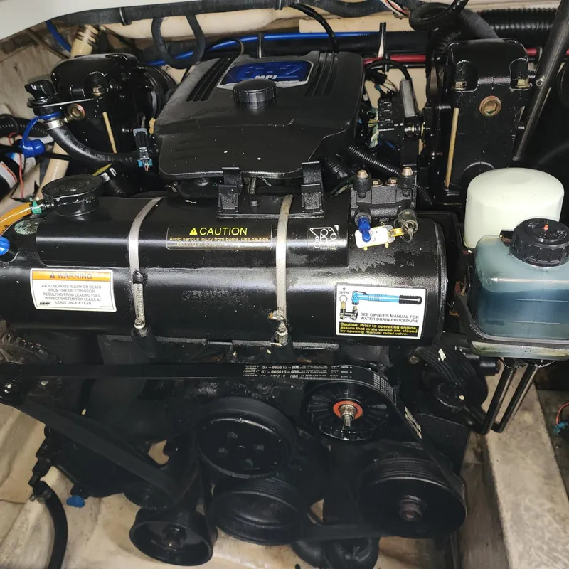 Slide: The Image of Engine of a 2008 Formula 310 Bowrider boat, showcasing detailed components. - 20