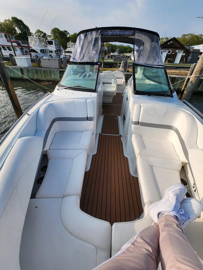 Slide: The Image of 2008 Formula 310 Bowrider with spacious seating and sleek design docked at marina. - 7