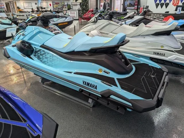 Slide: The Image of 2025 Yamaha WaveRunner VX® Limited HO in showroom, sleek blue design, side view. - 3