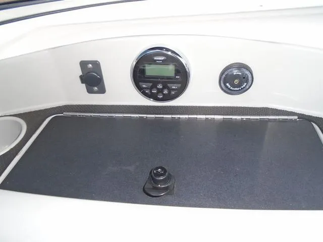 Slide: The Image of 2013 Bayliner 185 Bowrider dashboard with stereo system and controls. - 10