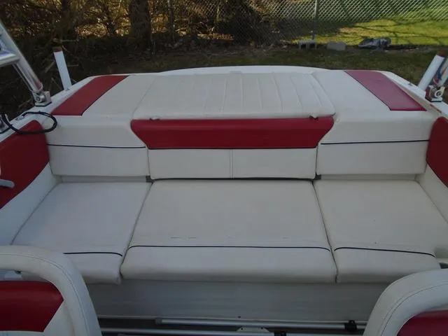 Slide: The Image of 2013 Bayliner 185 Bowrider interior with red and white seating. - 17
