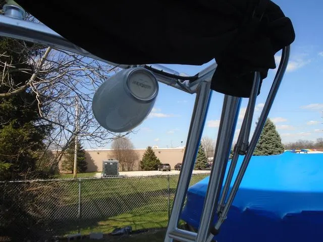 Slide: The Image of Outdoor view of a 2013 Bayliner 185 Bowrider with a mounted speaker. - 21