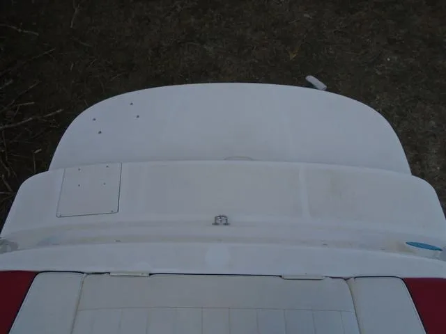 Slide: The Image of 2013 Bayliner 185 Bowrider boat stern view, white deck, outdoor setting. - 22