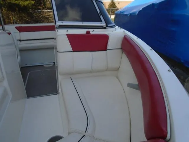 Slide: The Image of 2013 Bayliner 185 Bowrider interior with red and white seating. - 32