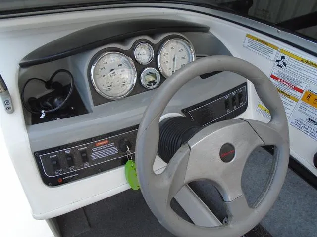 Slide: The Image of 2013 Bayliner 185 Bowrider dashboard with steering wheel and instrument panel. - 4