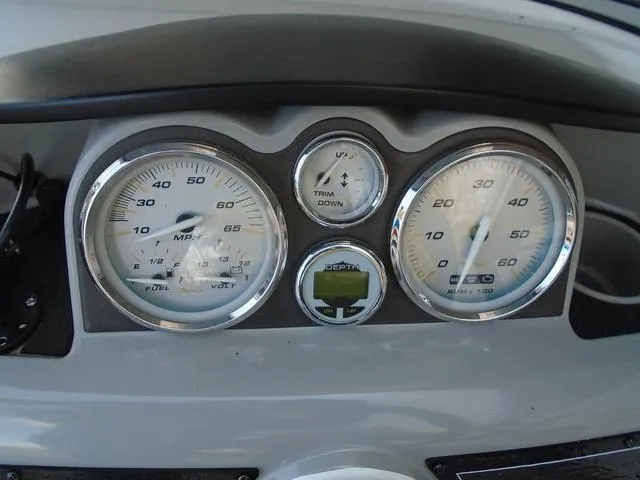 Slide: The Image of Dashboard of a 2013 Bayliner 185 Bowrider boat with speedometer and gauges. - 5