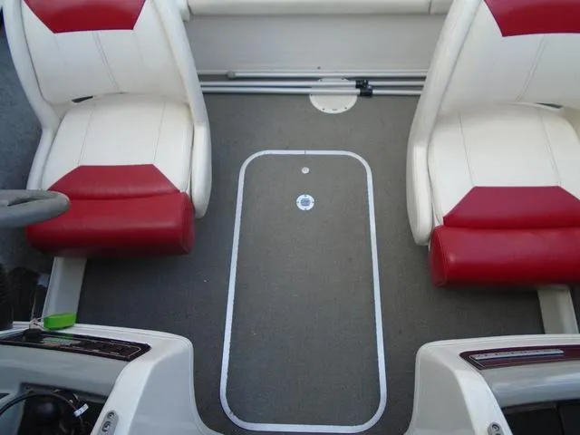 Slide: The Image of Interior of a 2013 Bayliner 185 Bowrider with red and white seating. - 8