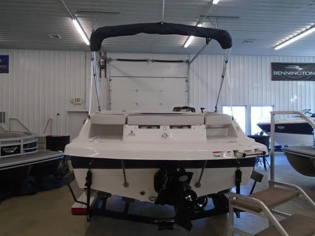 Slide: The Image of 2023 Hurricane SunDeck Sport 188 IO boat in showroom, rear view with canopy. - 13