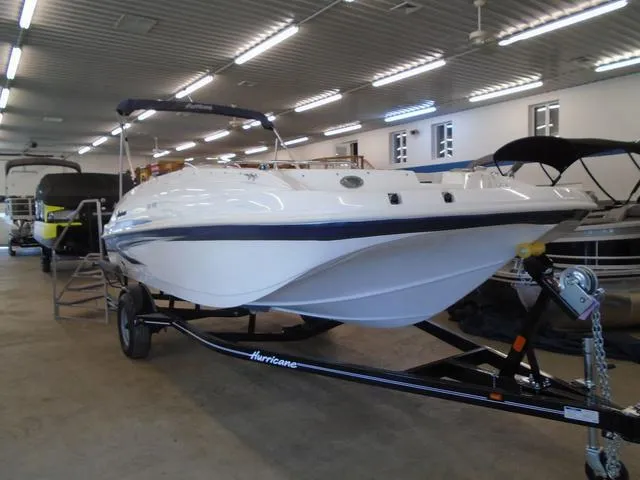 Slide: The Image of 2023 Hurricane SunDeck Sport 188 IO boat on trailer in showroom. - 19