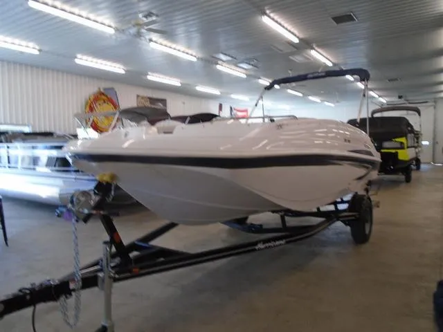 Slide: The Image of 2023 Hurricane SunDeck Sport 188 IO boat on trailer in showroom. - 20