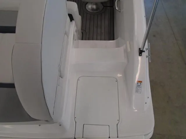 Slide: The Image of 2023 Hurricane SunDeck Sport 188 IO boat interior with white seating and deck details. - 23