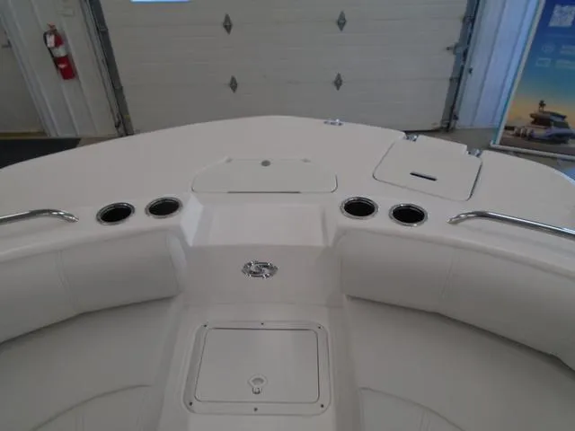 Slide: The Image of 2023 Hurricane SunDeck Sport 188 IO boat interior with cup holders and storage compartments. - 24