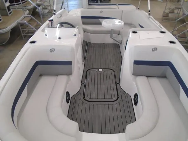 Slide: The Image of 2023 Hurricane SunDeck Sport 188 IO boat interior with spacious seating and sleek design. - 5
