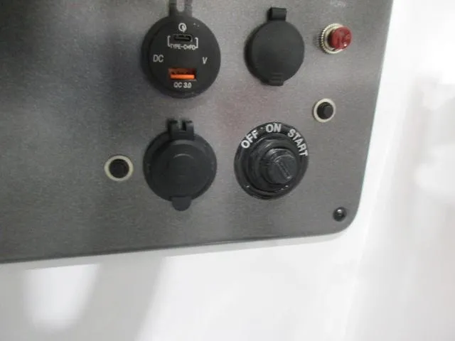 Slide: The Image of Control panel of 2023 Hurricane SunDeck 187 IO with switches and ports. - 10