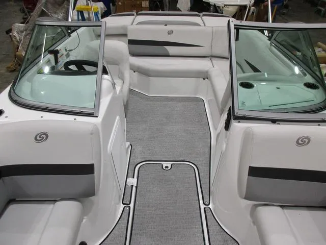 Slide: The Image of 2023 Hurricane SunDeck 187 IO boat interior with gray seating and carpet. - 6