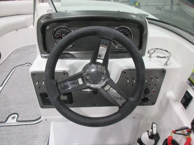 Slide: The Image of 2023 Hurricane SunDeck 187 IO dashboard with steering wheel and instrument panel. - 8
