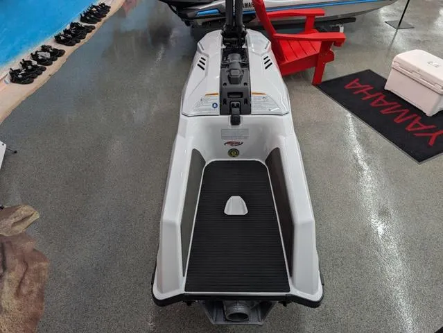 Slide: The Image of 2025 Yamaha WaveRunner SuperJet in showroom, rear view, sleek design. - 4