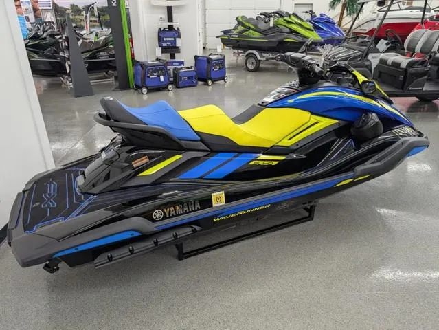 Slide: The Image of 2022 Yamaha WaveRunner FX Limited SVHO in showroom, blue and yellow design. - 4