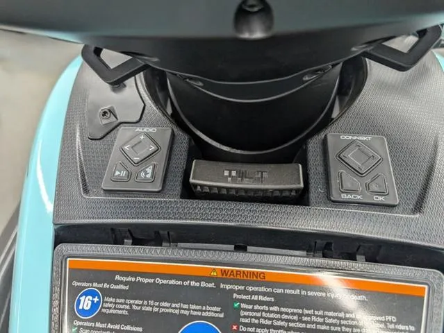 Slide: The Image of 2022 Yamaha WaveRunner FX Cruiser HO dashboard with audio controls and warning label. - 7