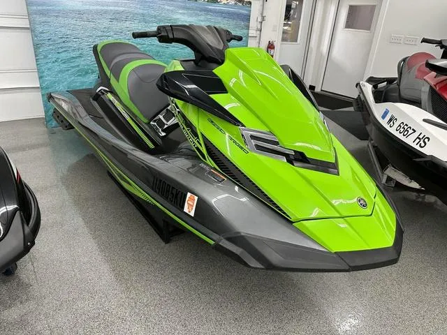Slide: The Image of 2016 Yamaha WaveRunner FX SVHO in vibrant green and black, displayed indoors. - 4