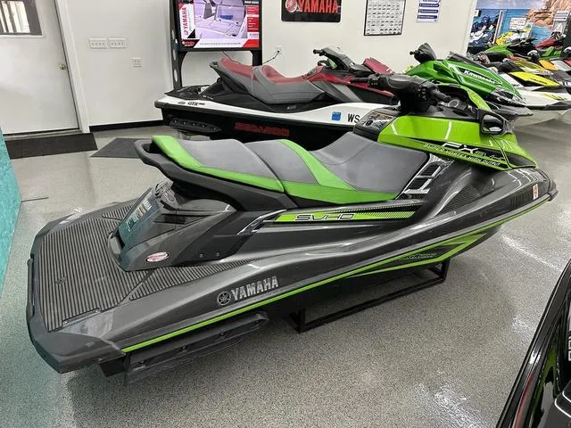 Slide: The Image of 2016 Yamaha WaveRunner FX SVHO in showroom, green and gray design, side view. - 5
