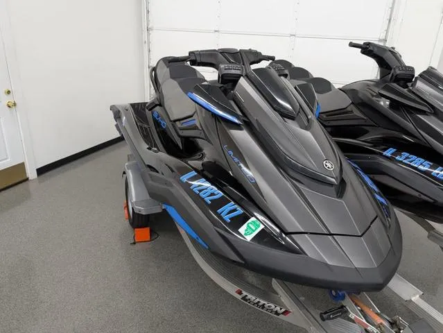 Slide: The Image of 2020 Yamaha WaveRunner FX Limited SVHO jet ski in showroom, sleek black and blue design. - 3